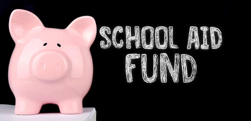Stock photo of a piggy bank against a blackboard with "School Aid Fund" written on it in chalk. 2021 marks the 7th year in a row where the Lottery contributed over $1 billion to MI's School Aid Fund, providing critical funds to public schools.