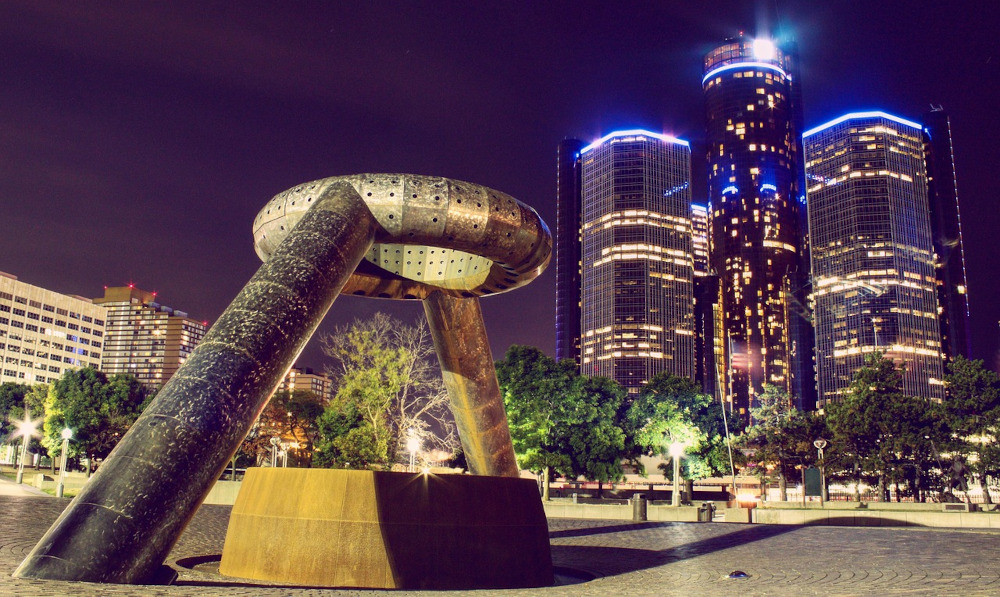 An abstract sculpture is seen in a plaza in downtown Detroit at night with buildings lit up around it. Michigan online poker is heading towards shared liquidity. Here's what we know so far about operator guidelines for multi-state poker in Michigan.
